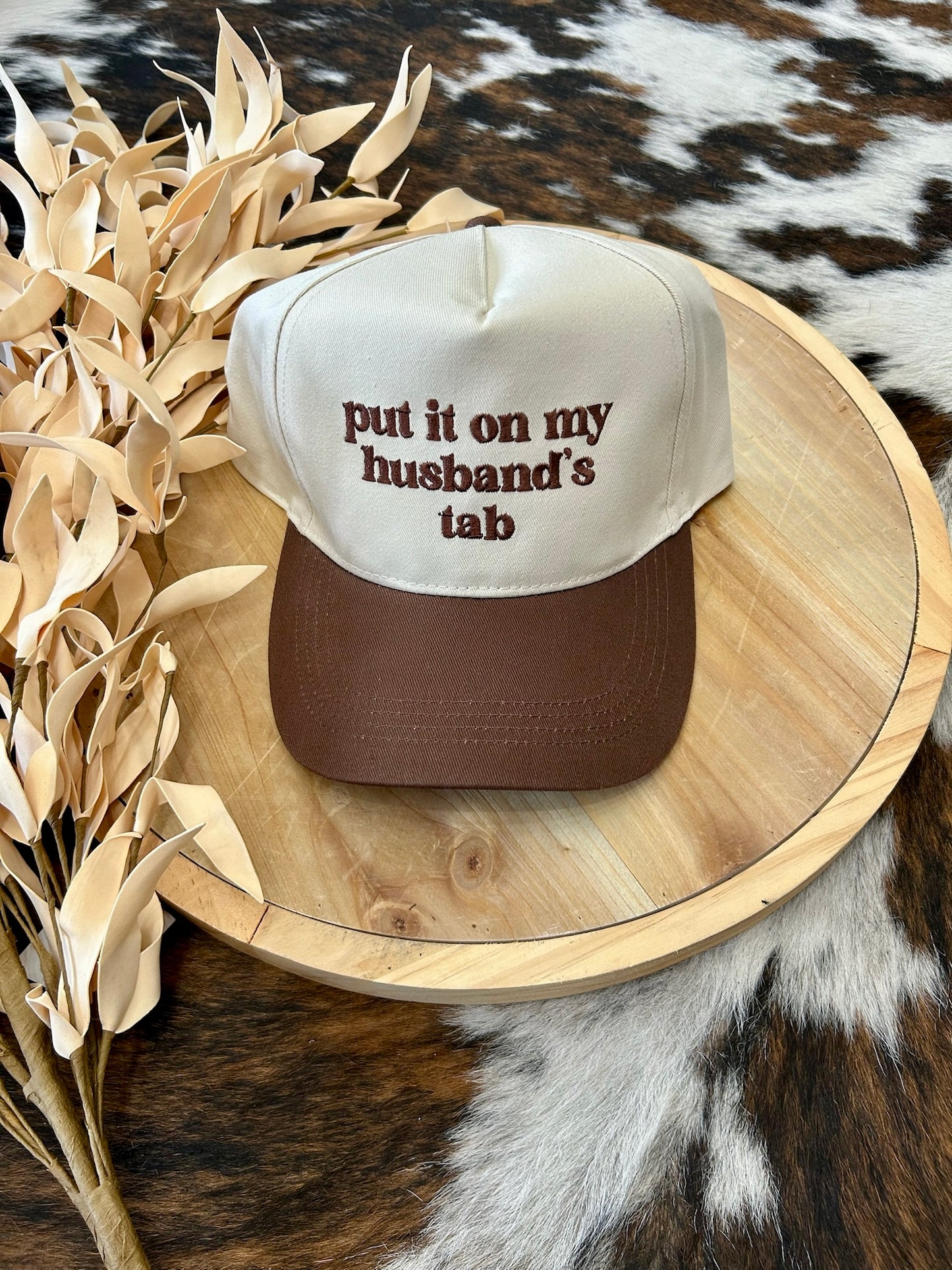 Put It On My Husband's Tab Brown Embroidered Trucker Hat