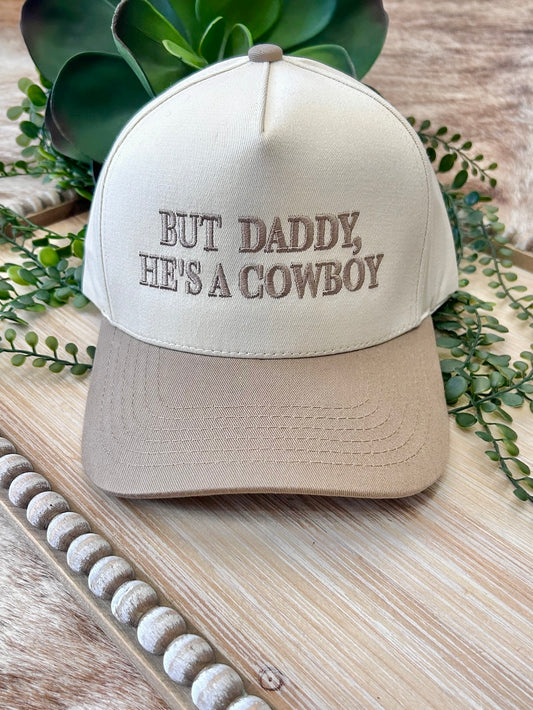 But Daddy, He's A Cowboy Beige Embroidered Trucker Hat
