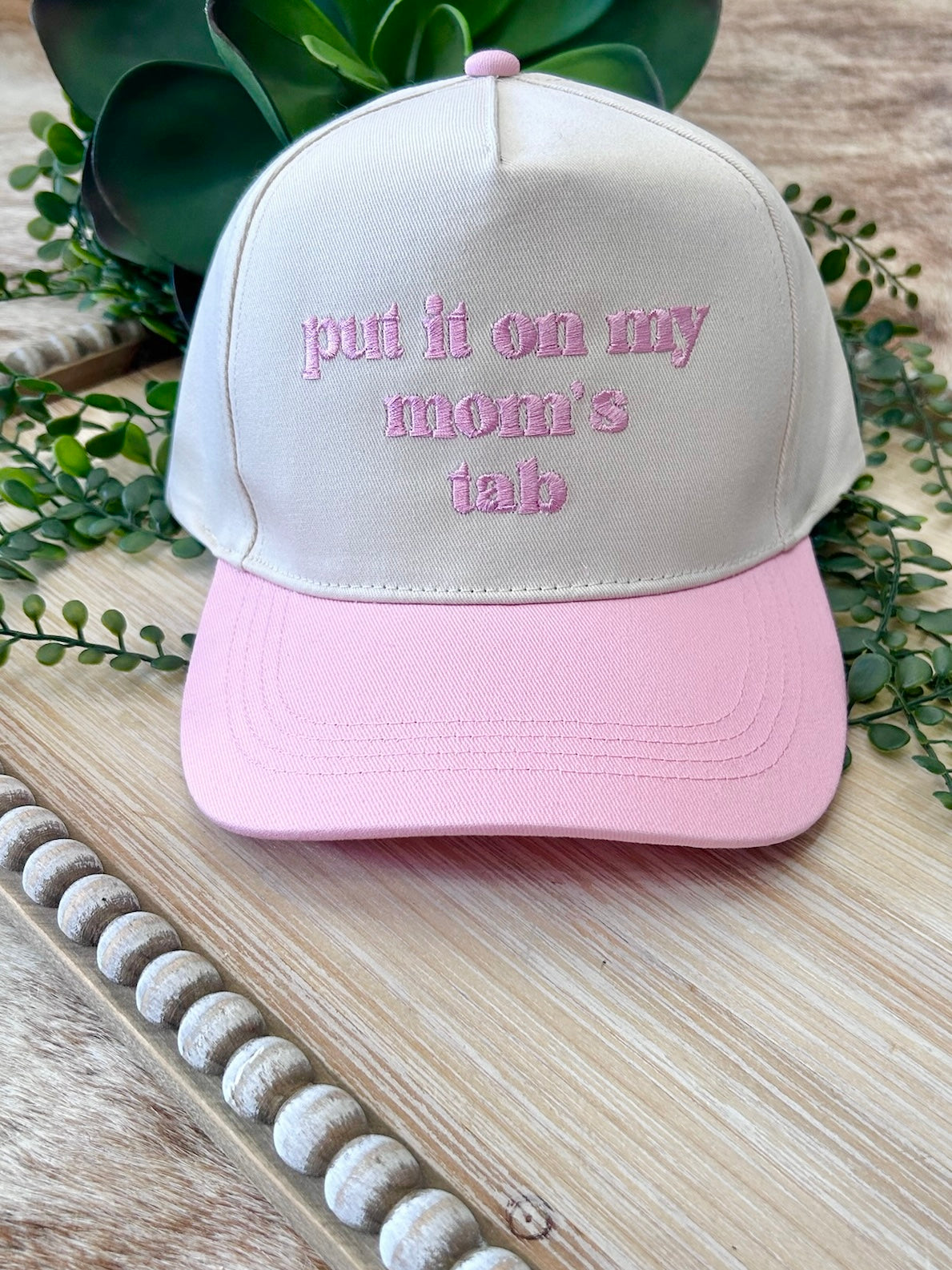 Put It On My Mom's Tab Pink Trucker Hat