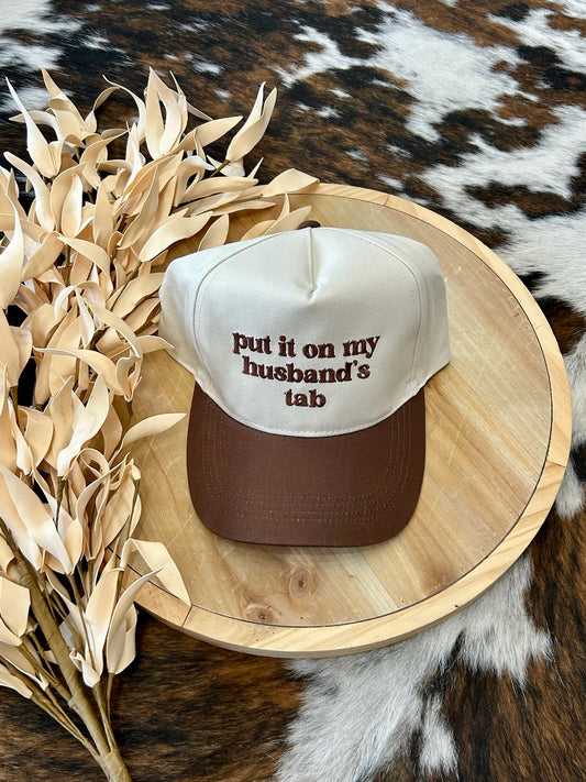 Put It On My Husband's Tab Brown Embroidered Trucker Hat